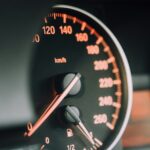 closeup photo of black analog speedometer