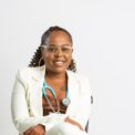 a woman in a white coat