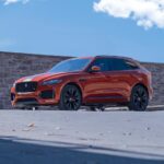 orange bmw m 3 coupe on gray concrete road during daytime