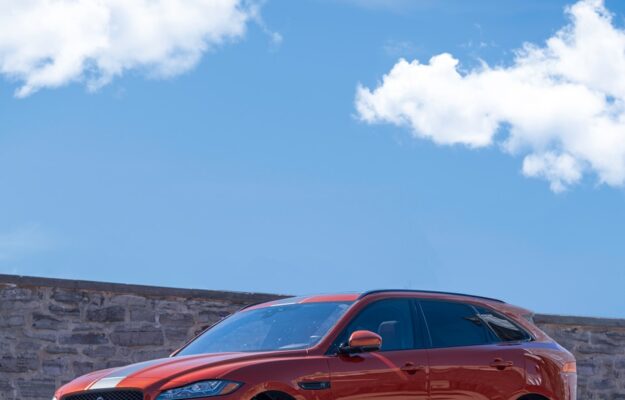orange bmw m 3 coupe on gray concrete road during daytime