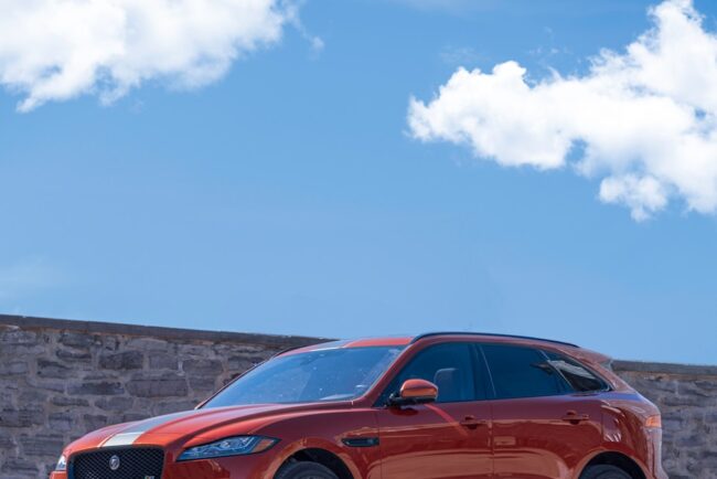 orange bmw m 3 coupe on gray concrete road during daytime