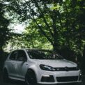 white bmw m 3 coupe parked on black asphalt road during daytime