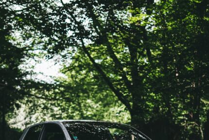 white bmw m 3 coupe parked on black asphalt road during daytime