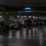 Cars parked in a dimly lit underground garage.