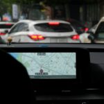 A car with a gps device on the dashboard